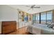 Main bedroom with hardwood floors, built-in shelving, and water view at 1255 N Gulfstream Ave # 1003, Sarasota, FL 34236