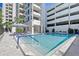 Refreshing community pool with surrounding patio at 1255 N Gulfstream Ave # 1003, Sarasota, FL 34236