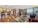 Open concept dining area and living room with hardwood floors at 1255 N Gulfstream Ave # 1003, Sarasota, FL 34236