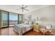 Bright bedroom with water views and hardwood floors at 1255 N Gulfstream Ave # 1003, Sarasota, FL 34236