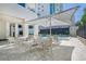 Relaxing pool area with patio tables and umbrella at 1255 N Gulfstream Ave # 1003, Sarasota, FL 34236