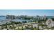 Aerial view of waterfront community with marina and cityscape at 1255 N Gulfstream Ave # 1003, Sarasota, FL 34236