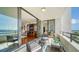 Wonderful balcony with seating and living room view at 1255 N Gulfstream Ave # 1003, Sarasota, FL 34236