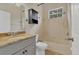 Bathroom with granite countertop, shower/tub combo, and linen cabinet at 22408 76Th E Ave, Bradenton, FL 34211