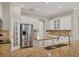 Island kitchen features granite countertops, stainless steel appliances, and white cabinets at 22408 76Th E Ave, Bradenton, FL 34211