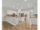 Spacious kitchen with granite countertops, stainless steel appliances, and white cabinets at 22408 76Th E Ave, Bradenton, FL 34211