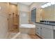 Bathroom with a large walk-in shower, garden tub, and granite countertop vanity at 22408 76Th E Ave, Bradenton, FL 34211