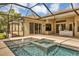 Enjoy this beautiful pool and spa with outdoor kitchen at 22408 76Th E Ave, Bradenton, FL 34211