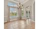 Elegant dining room with chandelier and large windows at 22408 76Th E Ave, Bradenton, FL 34211