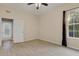 Bedroom with access to exterior and ceiling fan at 22408 76Th E Ave, Bradenton, FL 34211
