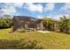 Landscaped backyard featuring a screened pool area at 22408 76Th E Ave, Bradenton, FL 34211
