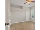 Bright bedroom with wood-look floors, large closet, and neutral walls at 22408 76Th E Ave, Bradenton, FL 34211
