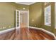 Bright office with hardwood floors, French doors, and built-in shelving at 22408 76Th E Ave, Bradenton, FL 34211