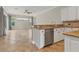 Open kitchen with granite countertops, stainless steel appliances and white cabinets at 22408 76Th E Ave, Bradenton, FL 34211