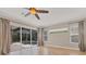 Spacious Gathering room with tile floors and sliding glass doors at 22408 76Th E Ave, Bradenton, FL 34211