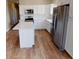 Modern kitchen with island and stainless steel appliances at 710 N Thomas St, Plant City, FL 33563