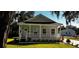 Craftsman style home with front porch and well manicured lawn at 710 N Thomas St, Plant City, FL 33563