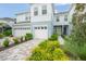 Two-story townhome with two-car garage and landscaped front yard at 4119 Via Sienna Cir, Sarasota, FL 34243