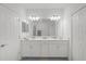Bathroom with double vanity and large mirror at 4119 Via Sienna Cir, Sarasota, FL 34243