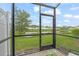 Relaxing screened porch with pond view in a community setting at 4119 Via Sienna Cir, Sarasota, FL 34243