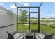 Screened porch overlooking a pond and community at 4119 Via Sienna Cir, Sarasota, FL 34243