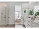Bright bathroom with walk-in shower, double vanity, and stylish fixtures at 18824 Dayspring Pl, Venice, FL 34293