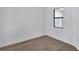 Bedroom features modern window and wood-look flooring at 18824 Dayspring Pl, Venice, FL 34293
