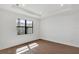 Bright bedroom features a modern window, recessed lighting, and wood-look floors at 18824 Dayspring Pl, Venice, FL 34293