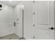 Modern glass shower featuring grey tiles and black hardware at 18824 Dayspring Pl, Venice, FL 34293