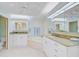 Bright bathroom featuring dual vanities, a jacuzzi tub, and ample storage space at 236 Hidden Bay Dr # 301, Osprey, FL 34229