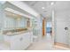 Bathroom with dual sinks, granite counters, tiled floors, and separate shower at 236 Hidden Bay Dr # 301, Osprey, FL 34229