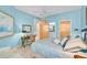 Comfortable bedroom with work desk, a stylish bed, and easy access to the ensuite bathroom at 236 Hidden Bay Dr # 301, Osprey, FL 34229