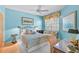 Cozy bedroom with stylish furnishings, large window, and warm lighting at 236 Hidden Bay Dr # 301, Osprey, FL 34229