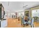Bright dining area with hardwood floors and an open floor plan into the living and kitchen spaces at 236 Hidden Bay Dr # 301, Osprey, FL 34229