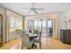 Bright dining area with waterfront views, sliding glass doors to the patio, and modern decor at 236 Hidden Bay Dr # 301, Osprey, FL 34229