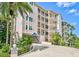 Multi-story residential building with balconies and manicured landscaping at 236 Hidden Bay Dr # 301, Osprey, FL 34229