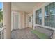 Welcoming covered front porch featuring seating at 236 Hidden Bay Dr # 301, Osprey, FL 34229