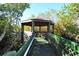 Secluded gazebo surrounded by lush foliage, offering a peaceful retreat at 236 Hidden Bay Dr # 301, Osprey, FL 34229