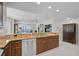 An open kitchen design features granite countertops and stainless steel appliances at 236 Hidden Bay Dr # 301, Osprey, FL 34229