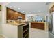 Kitchen features wood cabinetry, tile floors, granite countertops, and stainless appliances at 236 Hidden Bay Dr # 301, Osprey, FL 34229