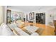 Bright living room featuring wood floors, neutral paint, and views to the water at 236 Hidden Bay Dr # 301, Osprey, FL 34229