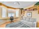 Inviting living room features built-in bookshelves, comfortable seating, and a well-lit bay window desk area at 236 Hidden Bay Dr # 301, Osprey, FL 34229