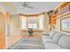 Bright living room featuring built-in shelves, and a bay window with a work space at 236 Hidden Bay Dr # 301, Osprey, FL 34229