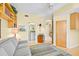 Living room adjacent to bathroom with wood floors, and an area rug at 236 Hidden Bay Dr # 301, Osprey, FL 34229