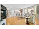 Open living space featuring wood floors, neutral paint, and large picture windows at 236 Hidden Bay Dr # 301, Osprey, FL 34229