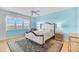 The main bedroom with water view features an en-suite bath and neutral paint at 236 Hidden Bay Dr # 301, Osprey, FL 34229