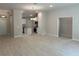 Open living space with kitchen view featuring an island, stainless steel appliances, and modern finishes at 5661 Gaffney Rd, North Port, FL 34286