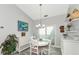Coastal-themed dining room with white furniture and a view to the outside at 267 Chartley N Ct, Sarasota, FL 34232