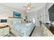 Main bedroom with large bed, dresser, and access to back patio at 267 Chartley N Ct, Sarasota, FL 34232