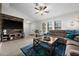 Spacious living room featuring a large sectional sofa and a rustic coffee table at 10194 Thames Ave, Englewood, FL 34224